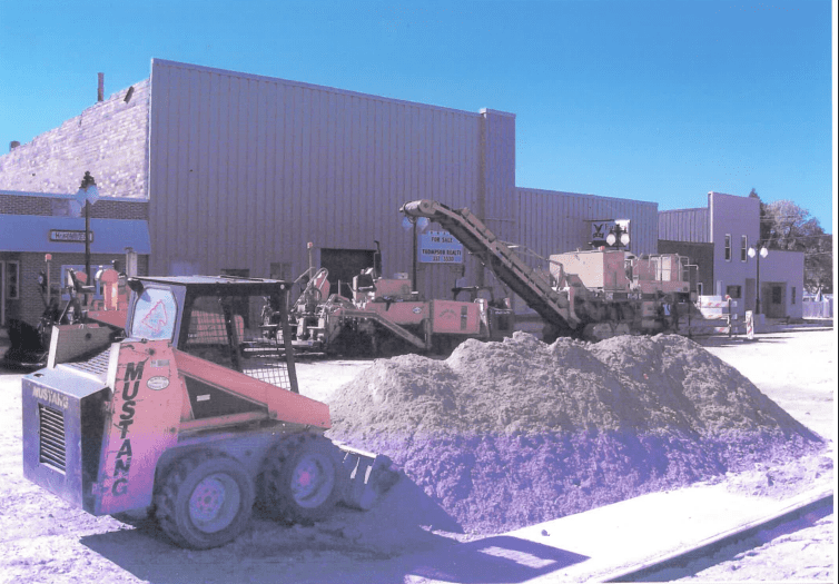 Dozer pushes fresh rock across street